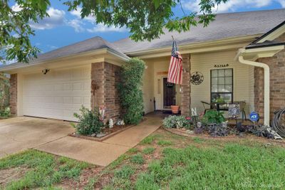 Ranch-style house featuring a garage | Image 3