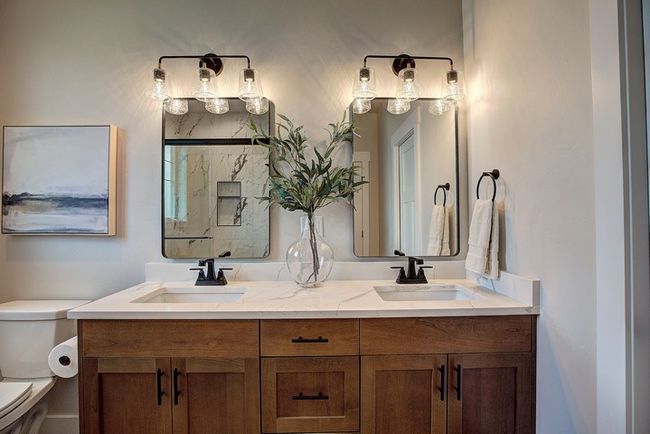 Bathroom featuring double vanity and a marble finish shower | Image 28