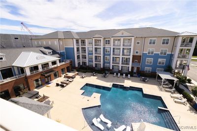 View of pool with a patio area | Image 1