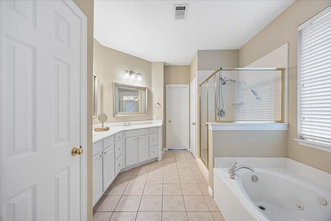 Lovely master bath opens onto her master closet | Image 18