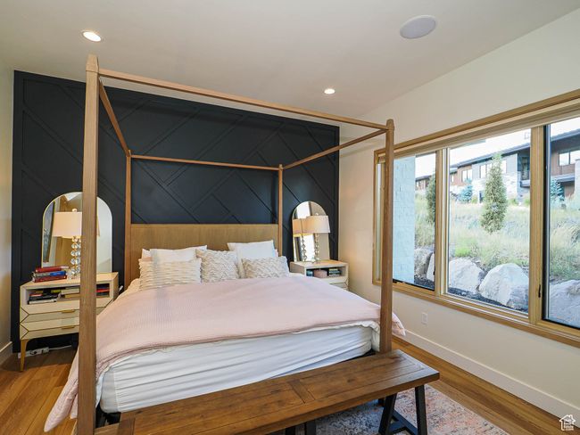 Bedroom featuring wood finished floors and recessed lighting | Image 45