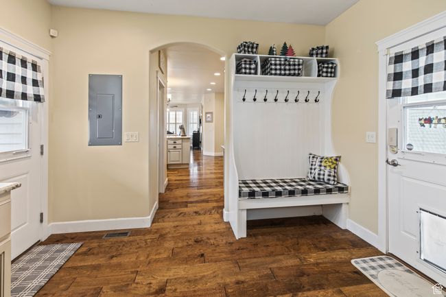 Mudroom featuring dark hardwood / wood-style floors and electric panel | Image 40