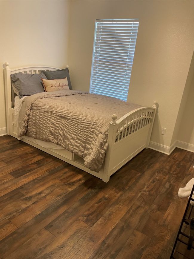 Bedroom with dark wood-style floors and baseboards | Image 20