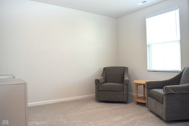 bedroom #4 located at back corner of home has view of pond | Image 34