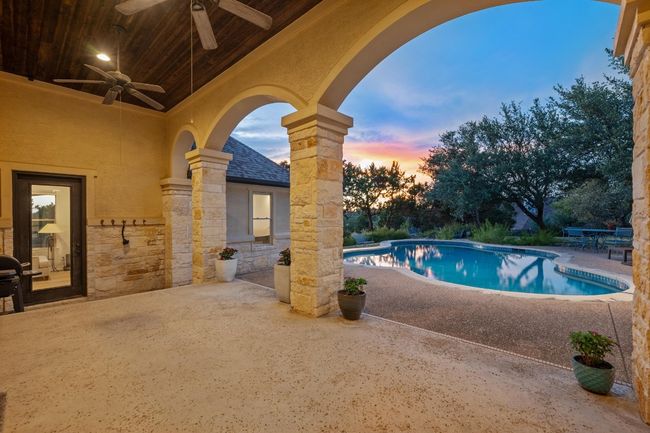 Outdoor pool with a patio area and ceiling fan | Image 30