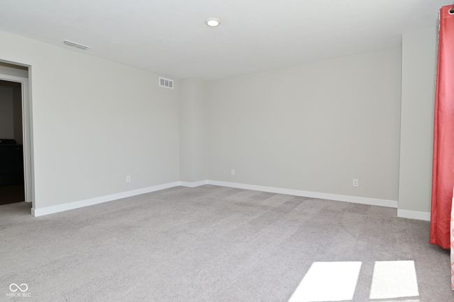 carpeted spare room featuring baseboards and visible vents | Image 20