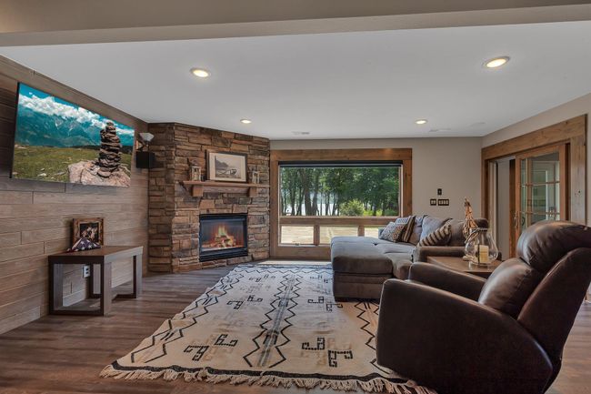 Cozy up by the fire with lake views | Image 16