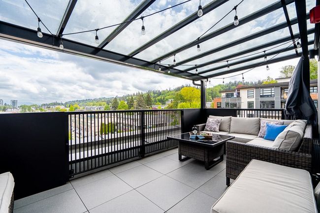 Wooden terrace with an outdoor living space and a pergola | Image 29
