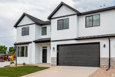 Modern farmhouse featuring a garage | Image 2