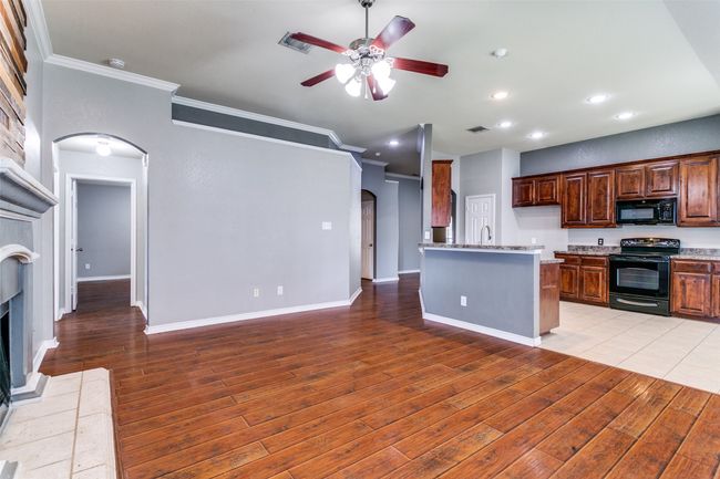 This open floorplan brings everyone together, whether you're cooking in the kitchen, enjoying a meal in the breakfast nook or relaxing in the living room, you are still in the heart of it all! | Image 11