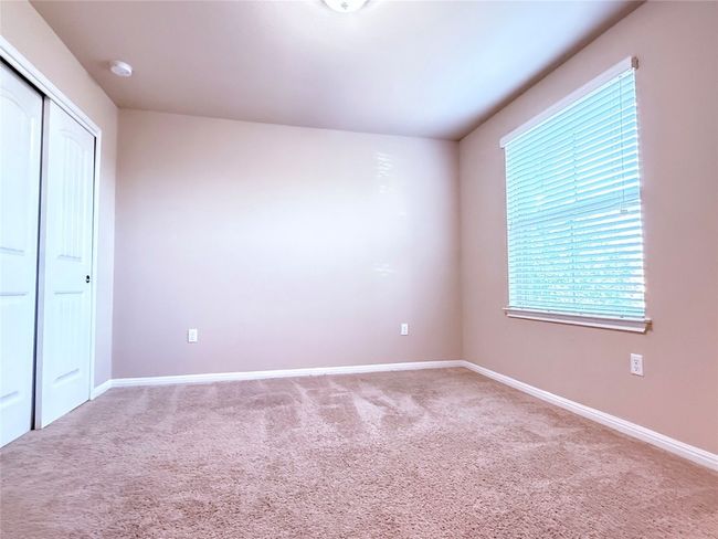 Unfurnished bedroom with carpet and a closet | Image 15