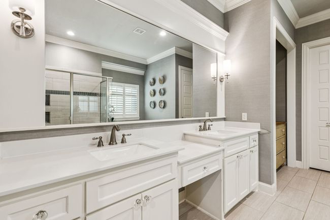 Primary bath features Caitlin Wilson grasscloth wallpaper and updated Drunmore signature scones | Image 24