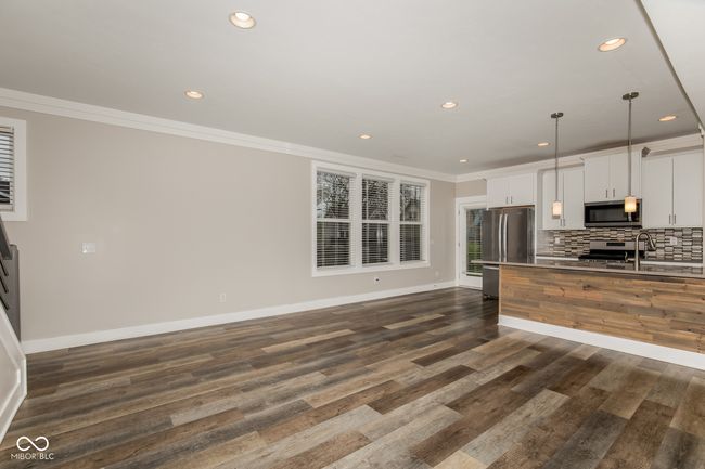 kitchen featuring recessed lighting, ornamental molding, baseboards, and stainless steel appliances | Image 18