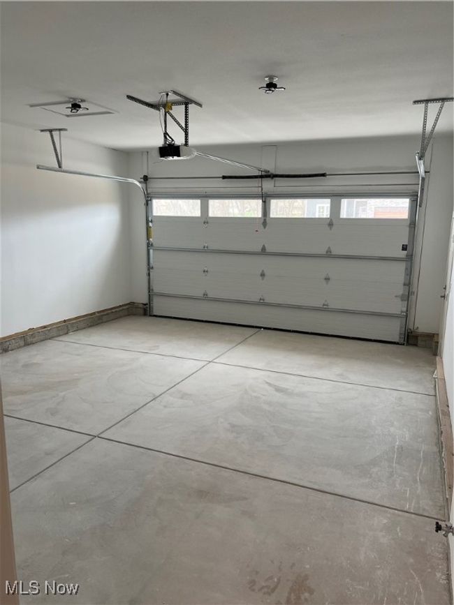 Garage with a garage door opener | Image 19