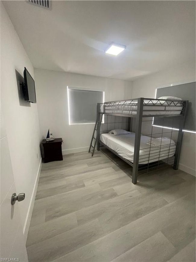 Bedroom with wood-type flooring | Image 13