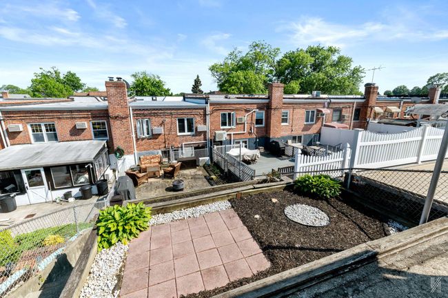 Rear view of property with a patio area, a fenced backyard, and an outdoor hangout area | Image 18