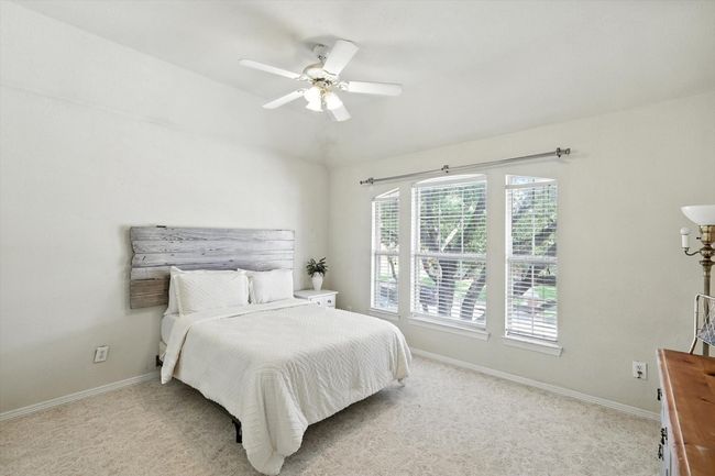 Carpeted bedroom with baseboards and ceiling fan | Image 27