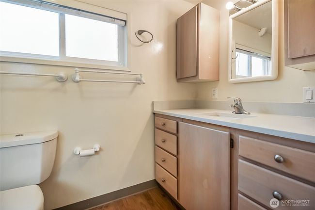 Lots of cupboard space in the full bath as well. | Image 21