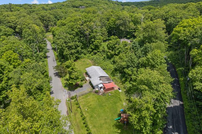Aerial view of a heavily wooded area | Image 4