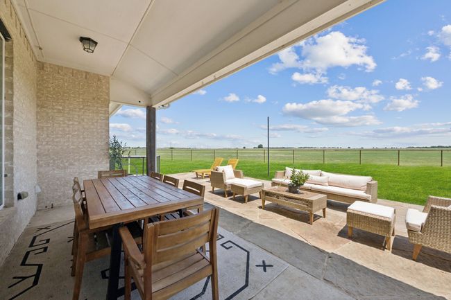 View of patio / terrace with an outdoor living space, outdoor dining area, and a rural view | Image 19