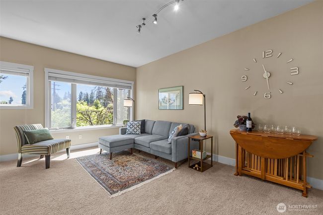 The Dining room space has plenty of space for either a small dining room table or a larger counch/more seating. With the eating bar, there is really no need for a table. | Image 13