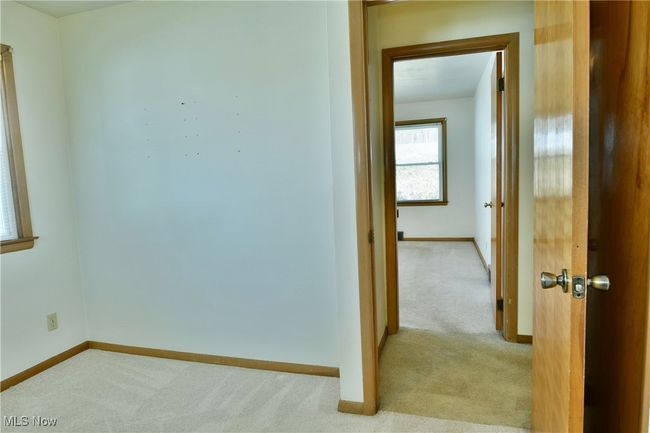 Hall featuring carpet floors and baseboards | Image 22