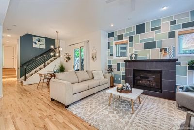 Living room with high ceilings and a gas fireplace | Image 2