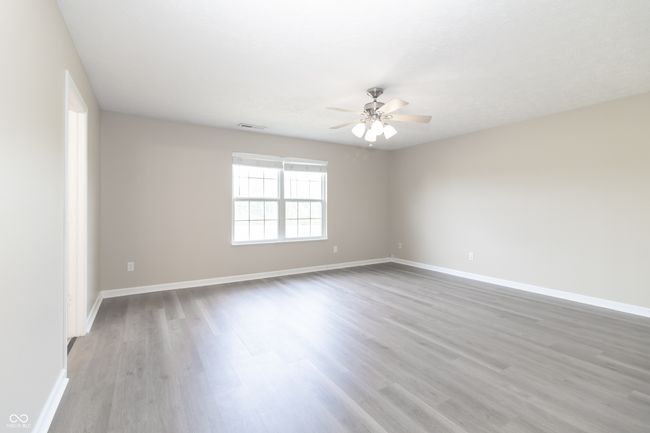 spare room featuring a ceiling fan and light wood-style floors | Image 15