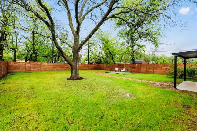 View of fenced backyard | Image 37