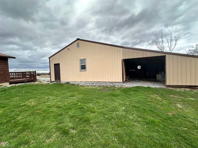 view of pole building featuring a lawn | Image 17