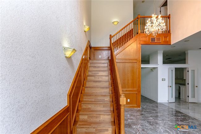 Grand staircase as you enter the front door | Image 6