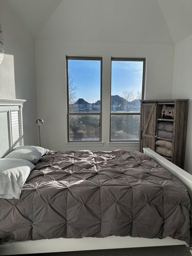 Bedroom featuring vaulted ceiling and a mountain view | Image 27