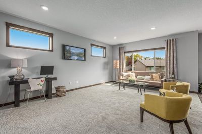 Spacious Great room with 2 fixed glass windows up high for lots of natural light. There's 9 foot knockdown ceilings on the main level. | Image 2