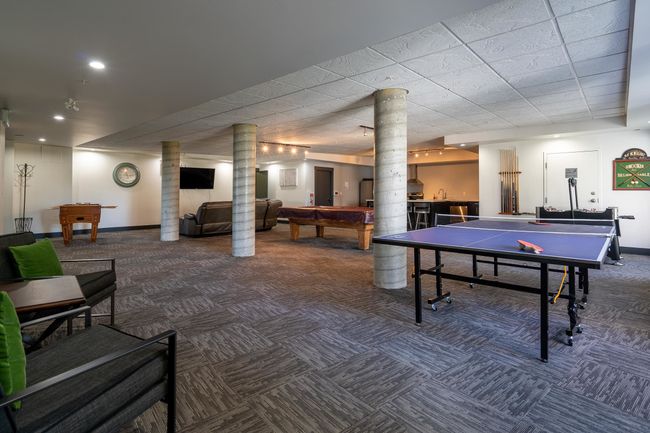 Recreation room featuring pool table, carpet floors, decorative columns, baseboards, and recessed lighting | Image 14