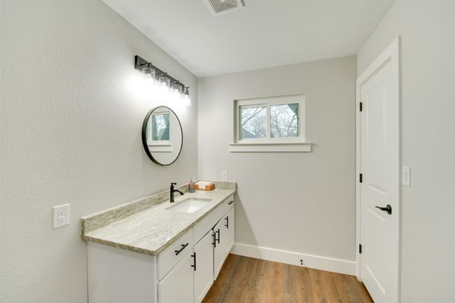 Bathroom featuring vanity, wood finished floors, visible vents, and​​‌​​​​‌​​‌‌​‌‌​​​‌‌​​‌‌​‌​​​​​‌ baseboards | Image 10
