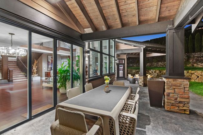 View of patio with outdoor dining area and stairway | Image 34