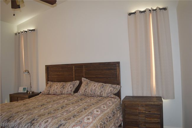 Bedroom featuring vaulted ceiling and a ceiling fan | Image 25