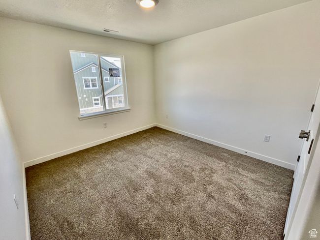 Empty room with dark carpet and baseboards | Image 17