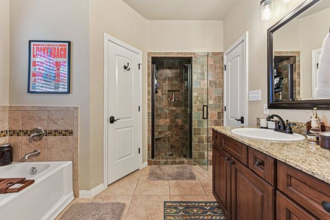 His and Hers separate closets and remodeled shower. | Image 25