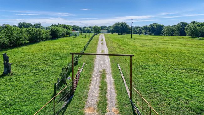 View of property's community with driveway and a rural view | Image 7
