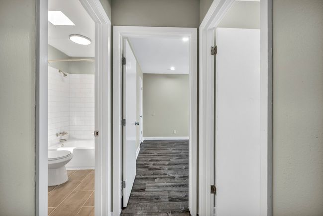Hallway featuring wood finished floors | Image 11