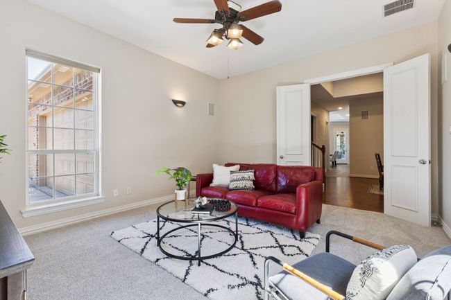 Another view of the media room with French doors. | Image 22