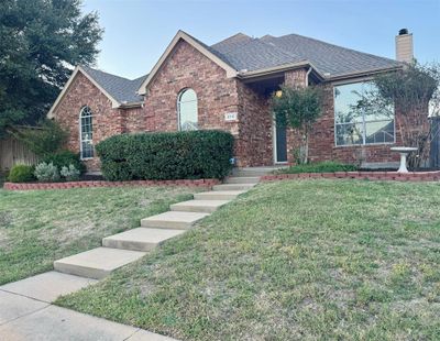 View of front of property featuring a front lawn | Image 1