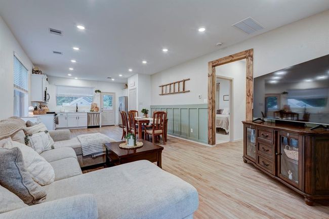 Notice the custom molding on the wall, painted doors and wooden beam door frame! | Image 8