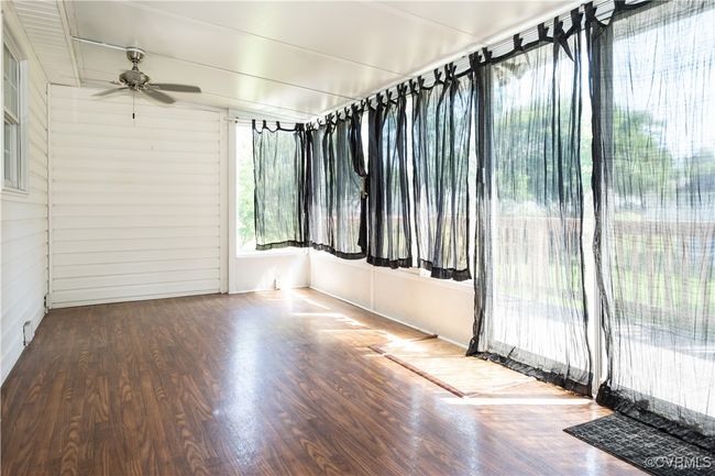 View of unfurnished sunroom | Image 17