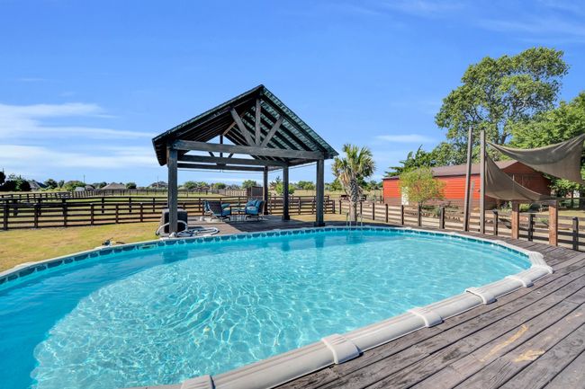 View of pool with a deck | Image 32