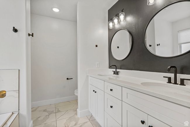 Full bathroom with marble finish flooring and double vanity | Image 13