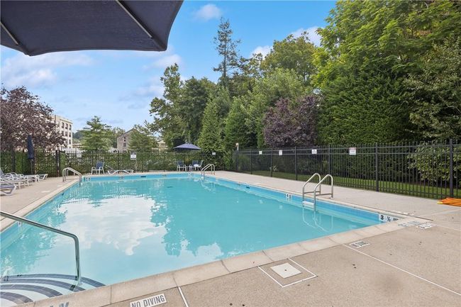 Inviting outdoor pool and pool house. | Image 20