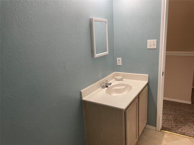 Bathroom with tile flooring and vanity | Image 17