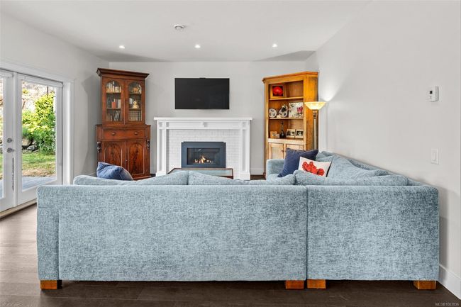 Living room with recessed lighting and a brick fireplace | Image 11